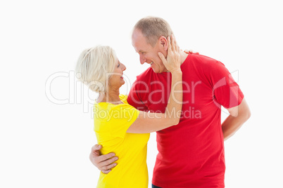 Happy mature couple hugging and smiling