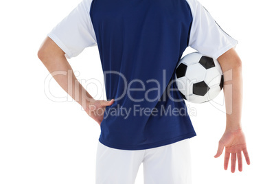 Football player in blue jersey holding ball Football player in blue jersey holding ball
