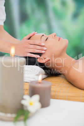 Beautiful brunette enjoying a head massage