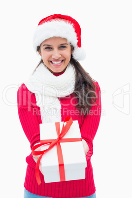 Beautiful festive woman offering gift