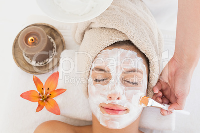 Attractive woman receiving treatment at spa center