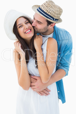 Happy hipster couple hugging and smiling
