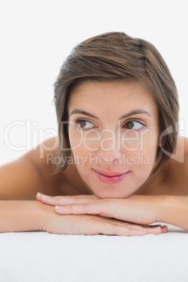 Close up of a beautiful young woman on massage table