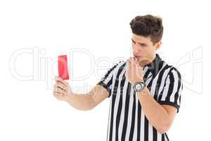 Stern referee showing red card