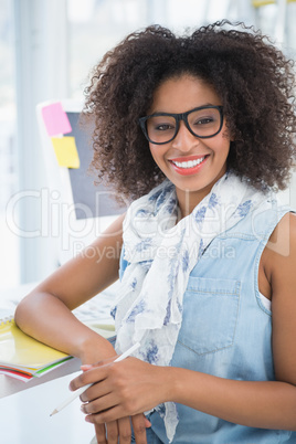 Pretty designer smiling at camera Pretty designer smiling at camera