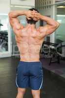 Rear view of a bodybuilder in gym