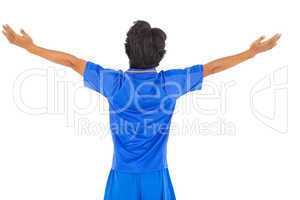 Football player in blue celebrating a victory