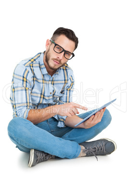 Handsome hipster using tablet pc