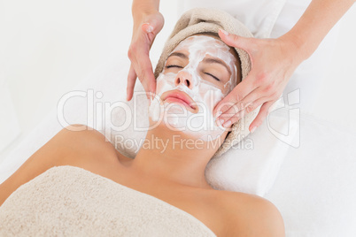 Attractive woman receiving treatment at spa center