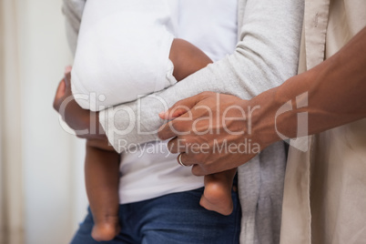 Happy parents spending time with baby