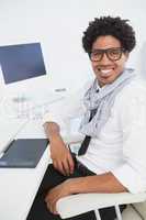 Hipster businessman working at his desk