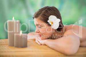 Beautiful young woman on massage table