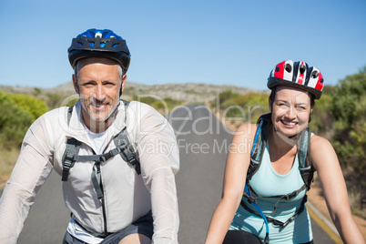 Active couple going for a bike ride in the countryside