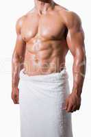 Shirtless muscular man in white towel