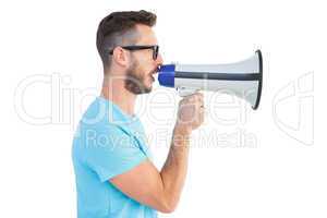 Handsome hipster talking through megaphone