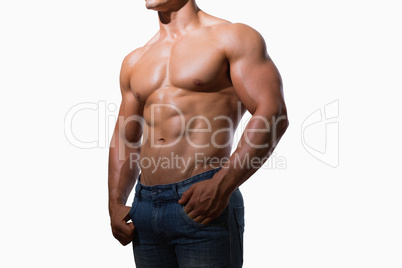 Mid section of a shirtless muscular man