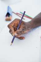 Man drawing with colour pencils