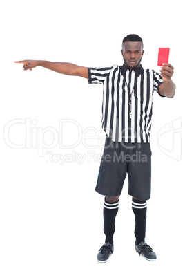 Serious referee showing red card