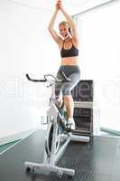 Spin class led by motivational instructor