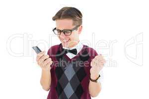 Excited geeky hipster texting on the phone