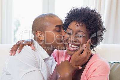 Happy couple relaxing on the couch