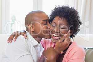 Happy couple relaxing on the couch