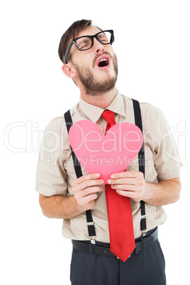 Geeky hipster crying and holding heart card