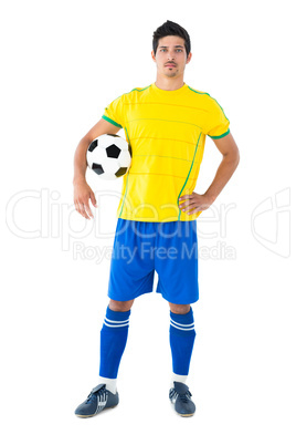 Football player in yellow holding the ball