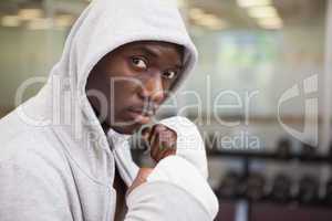 Boxer in hood jacket at health club