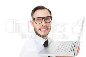 Geeky businessman holding his laptop