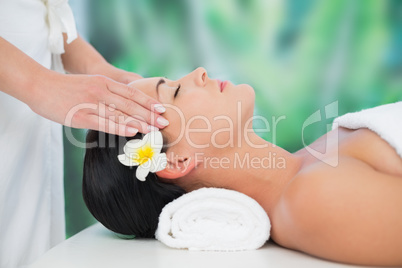 Beautiful brunette enjoying a head massage
