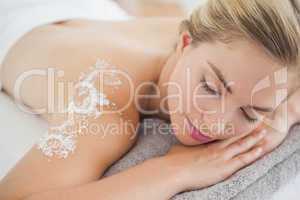 Beautiful blonde lying on massage table