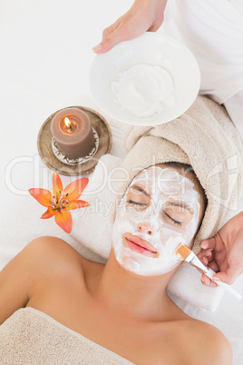 Attractive woman receiving treatment at spa center