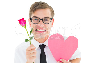 Geeky hipster holding a red rose and heart card