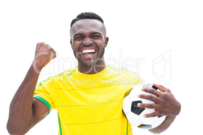 Football player in yellow celebrating a win