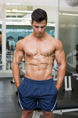 Muscular man looking down