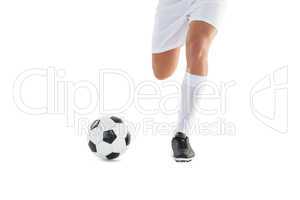 Football player kicking the ball