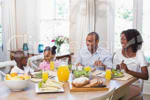 Happy family enjoying a healthy meal together