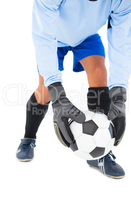 Goalkeeper picking up the ball