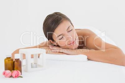 Close up of a beautiful young woman on massage table