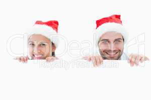 Festive young couple smiling at camera