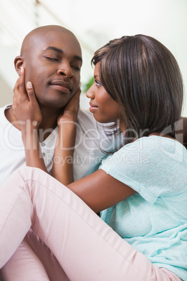 Happy couple relaxing on the couch