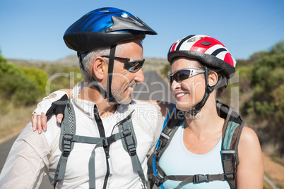 Active couple going for a bike ride in the countryside