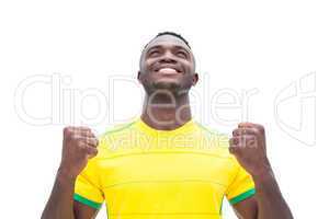 Football player in yellow celebrating a win