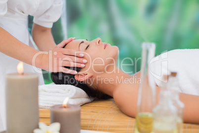 Beautiful brunette enjoying a head massage