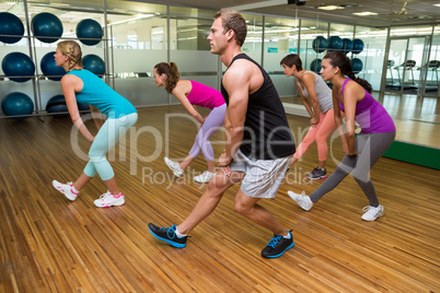 Fitness class led by handsome instructor