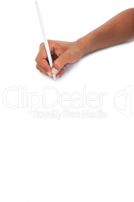 Mans hand holding white pencil