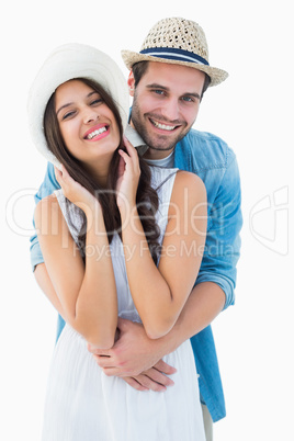 Happy hipster couple smiling at camera