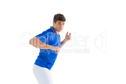 Football player in blue jersey jumping