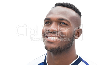 Happy football player in blue jersey